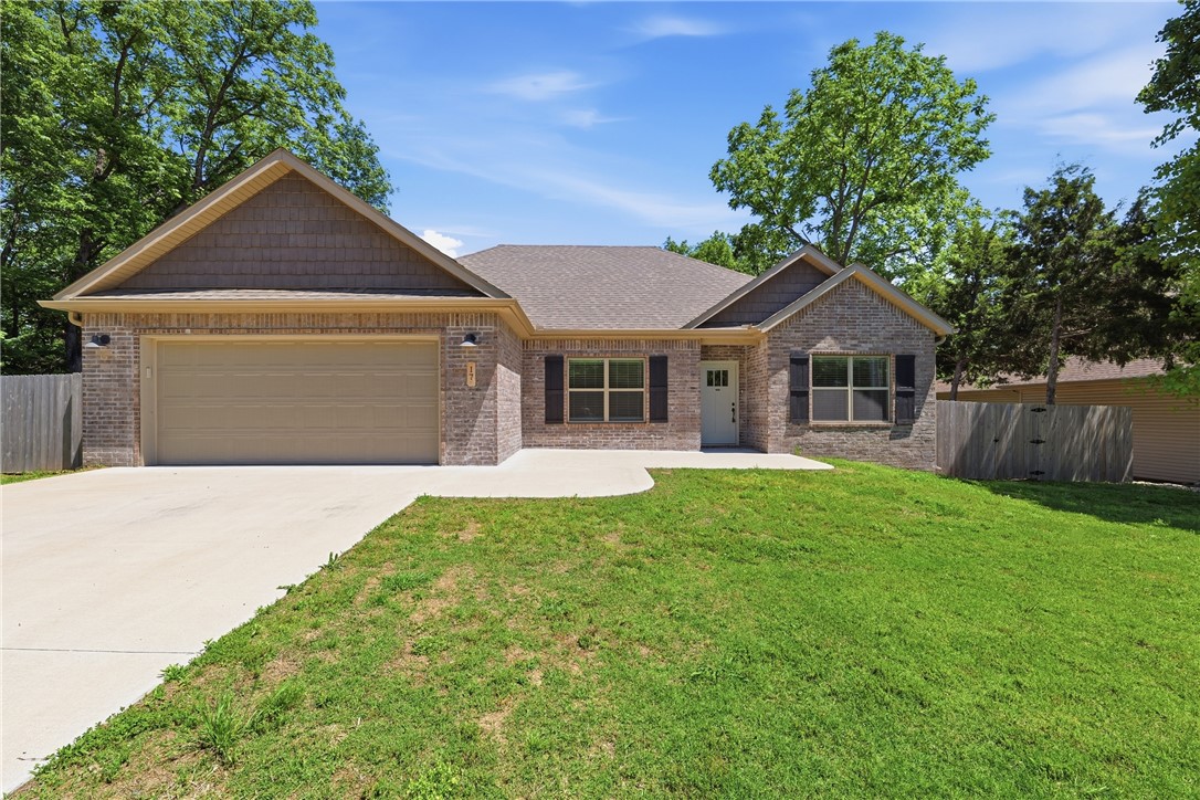 2 year-like new home combines high-end finishes with practical upgrades on a nearly level lot. Nestled on a beautiful cul-de-sac, the property offers both privacy & curb appeal. The split floorplan features 9-foot ceilings & upgraded flooring (No carpet).  The kitchen is equipped with GE Café appliances, including a gas range & refrigerator.  Custom cabinetry and quartz countertops are featured throughout the home. The 4th bedroom has been used as an office space (no closet). The spacious primary suite features dual vanities, a walk-in closet & tile shower. The garage features a 4x6 tornado shelter (EF5 rated).  Situated on an oversized 0.38-acre flat lot, the home also includes a fully fenced backyard and an 8-foot double gate. For extended outdoor living, enjoy the privacy of a large 15x10 covered back deck. Seller has converted septic system to public sewer. Conveniently located with easy access to Highway 71B, residents also enjoy proximity to Bella Vista’s 7 golf courses, 7 private lakes, and trails.