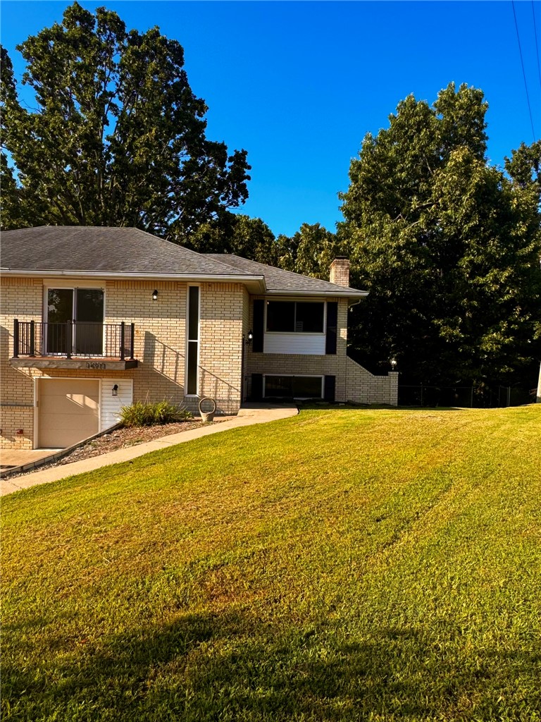 Beautifully remodeled 2-bedroom, 2-bath duplex located just minutes from Beaver Lake. This home features wood-style flooring throughout, an updated kitchen with quartz countertops and stainless steel appliances, and an open layout that flows into the living room. A separate family room with a fireplace provides additional living space and a cozy place to relax. Both bathrooms feature beautiful tile surrounds and showers, while the large enclosed porch and open deck offer great spaces to enjoy the outdoors. Additional highlights include a fenced yard and a large storage area on the lower level. Conveniently located near Prairie Creek Marina, parks, hiking trails, and just a short drive to downtown Rogers. **TENANT PLACEMENT ONLY - $500 non-refundable pet fee per pet + $35 pet rent per pet**
