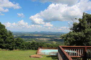 Great house, wonderful view from the bluff on Orchard Point Road. Newly remodeled, granite counter tops, above ground pool with surrounding deck, large rooms, cozy kitchen & breakfast area, full basement, covered deck. Better see this one!!