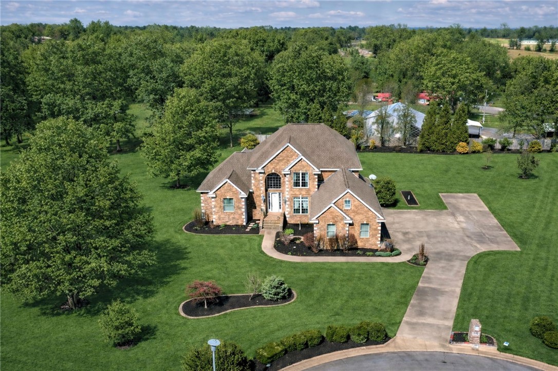 Fantastic West Fayetteville home situated on 2.0 manicured acres in a quiet cul-de-sac. This 5,110 heated square foot property offers 5 bedrooms, 3.5 baths, and multiple living spaces designed for comfort and flexibility.Main level features include an open kitchen flowing into the living area, formal dining room, and spacious primary suite. The finished basement provides additional living space with a second living room, wet bar, pool table/game room, safe room, and abundant storage throughout the home. The 2nd level contains a landing area, bonus room, and 2br/2ba. Additional features include: : 3-car side-entry garage,3 outdoor patios, 2 fireplaces, central vacuum system, security system, and a Marathon hot water heater with recirculator Beautifully maintained acreage offers privacy while remaining convenient to Fayetteville amenities.New Roof 5-26.  *$5,000in preferred lender credits!*