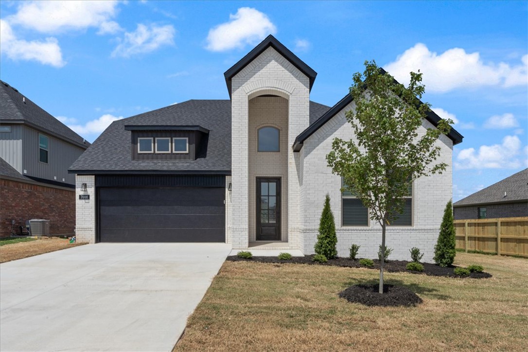 Builder offering up to $5,000 towards buyers closing costs, rate buydown or towards an appliance package like refrigerator, washer/dryer! Unmatched quality awaits in this new construction home with primary bedroom, bathroom, primary closet & second guest bedroom & full bathroom on main level. The second story features two additional guest bedrooms & full bathroom. Upgrades include quartz countertops, two-story open entry way, upgraded lighting fixtures, custom cabinets, black stainless steel appliances, gas fireplace, gas range, tiled walk in shower in primary bath & luxury vinyl plank floors throughout all bedrooms & common areas. Step outside to enjoy the backyard, with direct acess to the pond & walking trails! Enjoy standard inclusions such as insulated garages, full home gutters, privacy fence, & 2” blinds throughout. Community pool coming soon! Under 10 minutes to XNA Airport and under 20 minutes to Downtown Bentonville & New Walmart Campus! Ask your agent about the additional preferred lender credit.