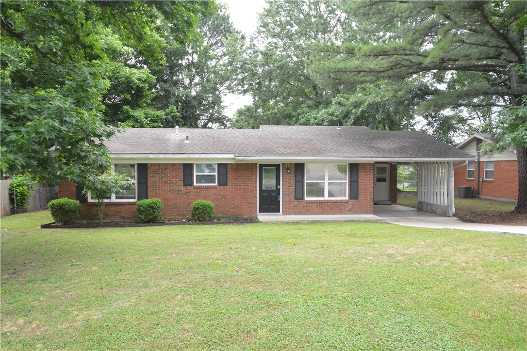 Enjoy this open floor plan just minutes from Tyson Corporate offices . Lots of remodeling in 2015, that included ceramic tile flooring through-out , new kitchen cabinet package , A/C unit , full & half bathrooms updated , new paint, lighting fixtures .  New bedroom carpeting has just been installed !  Nice large backyard with fully covered back patio .  Third bedroom area has been opened up for office/flex space .