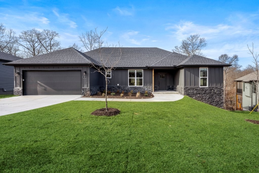 Beautiful new construction home just minutes from Loch Lomond, Highlands Golf Course, & quick access to I 549. This modern, thoughtfully designed home offers an open layout filled w/natural light & peaceful wooded views. The spacious living area flows seamlessly into the dining space & bright kitchen, featuring custom soft close white cabinets, stainless steel appliances, pendant lighting, pantry & large island perfect for gathering. LVP Wide plank flooring adds warmth & style throughout main living spaces. The luxurious primary suite includes a beautiful custom tiled walk-in shower with frameless glass, dual vanities, matte black fixtures, & a connected walk-in closet for everyday convenience. Step outside to an inviting back deck, ideal for relaxing or entertaining. With quality finishes including blinds & gutters, functional design, & a prime Bella Vista location near lakes, golf, trails, & commuter routes, this home delivers comfort, convenience, & elevated living. 100% financing ($0 down payment) available!