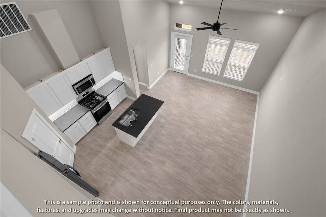 Welcome to Crystal Cove, where modern design meets everyday comfort in this beautifully crafted 3-bedroom, 2.5-bath townhome by Sunrise Homes. This ~1,582 sqft layout features a desirable primary suite on the main level, offering both convenience and privacy. The open-concept living space is highlighted by a soaring vaulted ceiling and large Clerestory Windows bringing in natural light for a bright, airy feel throughout. Also featuring a sleek electric fireplace, creating an inviting atmosphere. The kitchen flows seamlessly into the dining and living areas, perfect for entertaining. Upstairs includes two additional bedrooms, a full bath, and a loft-style hallway overlooking the main living area. Enjoy outdoor living with a covered back patio and private backyard. Low-maintenance living with thoughtful design throughout makes this home ideal for a variety of lifestyles.  Builder’s credit of $3,000 and Lenders Credit Up To $5,000 with Preferred Lender.