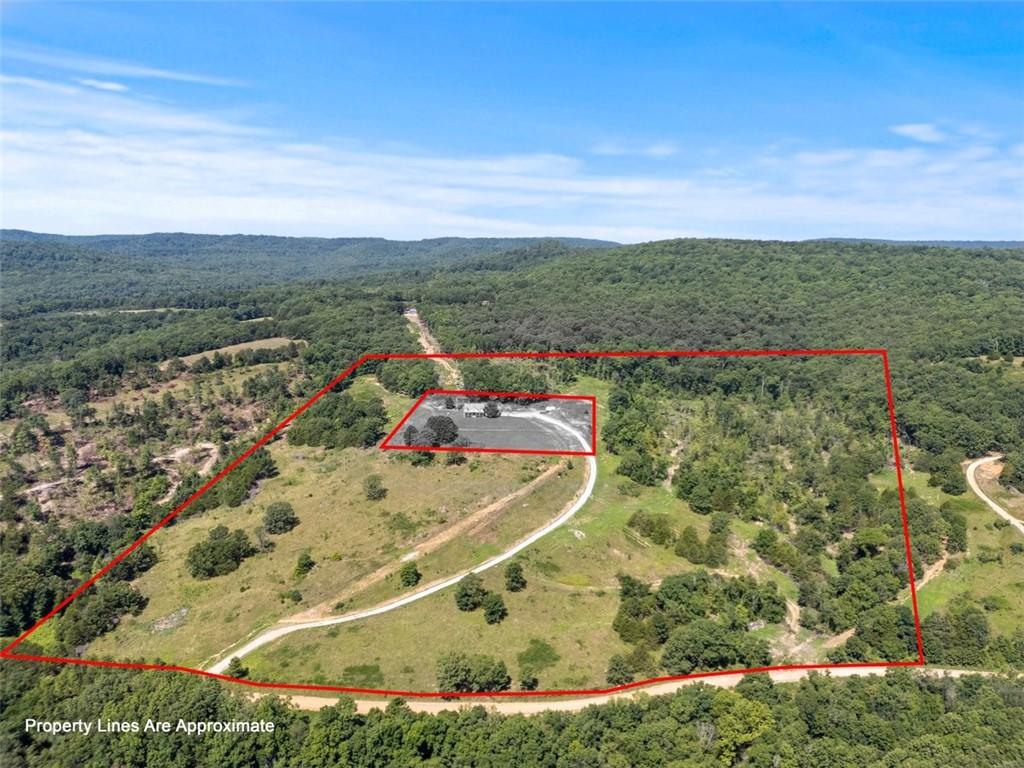 Don't miss this incredible opportunity to own 28.65 +/- acres of breathtaking views and endless potential! Whether you're dreaming of building your forever home, starting a hobby farm, or simply investing in a slice of Northwest Arkansas beauty, this property delivers. With rolling hills, open spaces, and unmatched scenery, the possibilities are truly limitless. Enjoy peace, privacy, and the freedom to create your ideal lifestyle-all in a stunning natural setting.