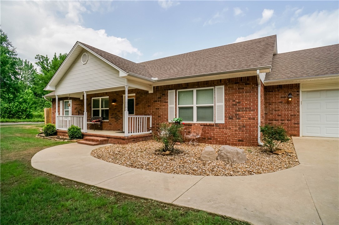 Welcome to this charming 3-bedroom, 2-bathroom home in Clarksville, Arkansas, offering 1,712 square feet of spacious living. Featuring an open floor plan, this home seamlessly blends the kitchen, dining, and living areas, making it perfect for entertaining or everyday living. The vaulted ceilings add an airy feel and enhance the natural light that pours in through large windows. The split floor plan offers privacy for the primary suite, which includes an ensuite bath and walk-in closet. Outside, you'll enjoy a fully fenced backyard for added privacy, a back patio perfect for relaxing or outdoor dining, and a two-car garage with a large attic space providing ample storage and convenience. This home is a must-see!
