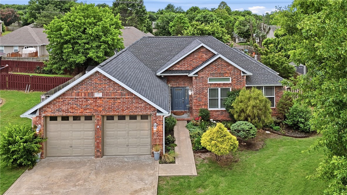 This contemporary style, one-level home in west Fayetteville is close to an abundance of amenities & conveniences. Only 1 block to the recently remodeled community pool with beach entry, 7 minutes to I-49, 11 minutes to University of Arkansas, and a short drive to grocery stores, restaurants & entertainment. Beautifully landscaped backyard from the huge deck with pergola & dog ramp. Home includes fresh paint throughout most of the interior, gas stub behind the range, split bedroom floor plan, huge primary suite, stained concrete & tile floors throughout, double-sided fireplace with gas logs & remote control, recently updated electrical panel & whole-home surge protector, built-in speakers, custom windows on front of home & updated faucets, lights & fans throughout. AC & roof are 6 years old. Kitchen fridge, garage fridge, washer, dryer, detached cabinets in kitchen, Arlo security camera, shed & bird bath convey. Several furniture pieces are for sale or possibly negotiable with acceptable offer.