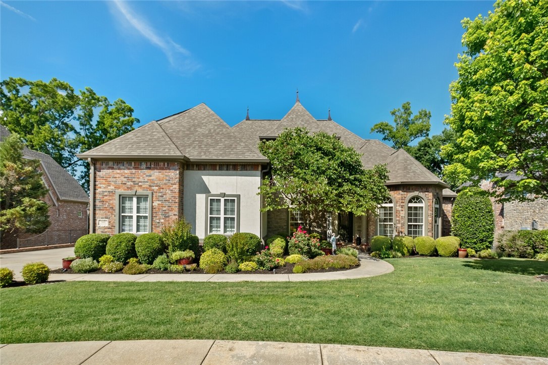 Located in Shadow Valley Country Club, this pristine, golf front, 5-bedroom home offers amazing amenities throughout its updated designer interior! Sought out floorplan with spacious open living concept featuring large great room with fireplace open to Dining Room and Kitchen. Chefs eat-in kitchen with island, top-of-the-line stainless steel appliances including double ovens, gas range & walk-in pantry all open to the eat-in area with access to a covered outdoor living space overlooking the golf course. Enjoy the owner’s suite with spa like bathroom & closet plus a second guest suite/office on the main level.  Second level hosts 3 bedrooms with 2 full bathrooms & a large bonus/game room space & theater with kitchenette featuring a mini refrigerator & microwave. Relax and entertain outside in the fully fenced, private backyard while taking in magnificent golf course views. Other features include a large laundry/mudd room with bathroom & cubbies & 3 car garage. Located in Bentonville Schools.