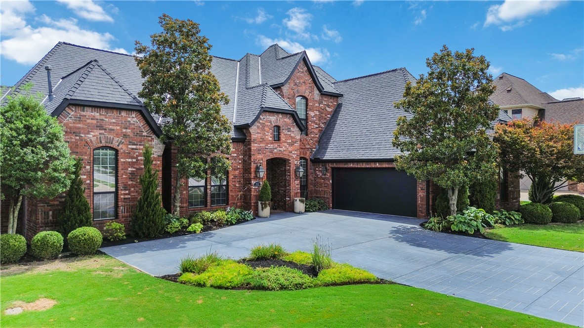 Modern luxury meets timeless elegance in The Peaks! This beautifully updated executive home showcases today's sought-after designer finishes, offering the perfect blend of sophistication, comfort, and functionality. Featuring 4-5 bedrooms, 4 full baths, a dedicated office, and gorgeous 5" hardwood floors throughout the main level. The chef-inspired kitchen features stunning Marble countertops, a large center island with breakfast bar, gas cooktop with pot filler, double ovens, walk-in pantry, and updated appliances. The luxurious primary suite plus an additional bedroom and full bath on the main level provide exceptional flexibility for guests or multigenerational living. Enjoy the private, level fenced backyard complete with an oversized richly stained patio, built-in grill, professional landscaping, and irrigation system. Ideally located just minutes from Pinnacle Hills Promenade, Walmart AMP, Topgolf, premier dining, shopping, hospitals, and I-49. Move-in ready and designed for today's luxury lifestyle!