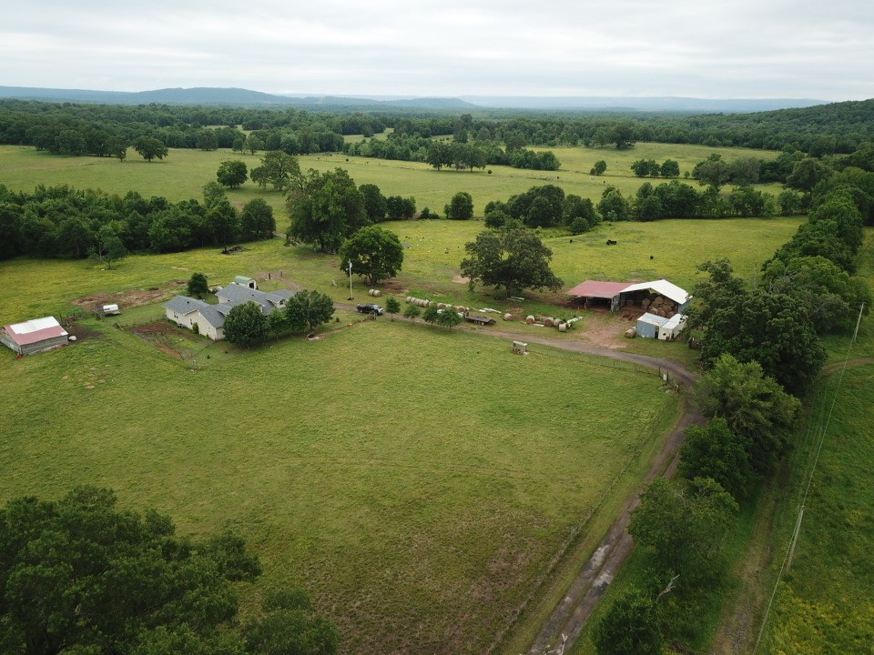 Presenting a generous 4- bedroom home featuring a sizable kitchen and a roomy living area enhanced by a cozy wood burning stove. The delightful covered front porch serves as a perfect retreat for enjoying the beautiful outdoors.
This impressive farm offers over 82 acres of lush pastureland, accompanied by various outbuildings for added utility. 
Nestled at the end of a peaceful dead-end road, this property ensures a serene environment free from traffic noise. This home also had a new roof put-on in 2024.