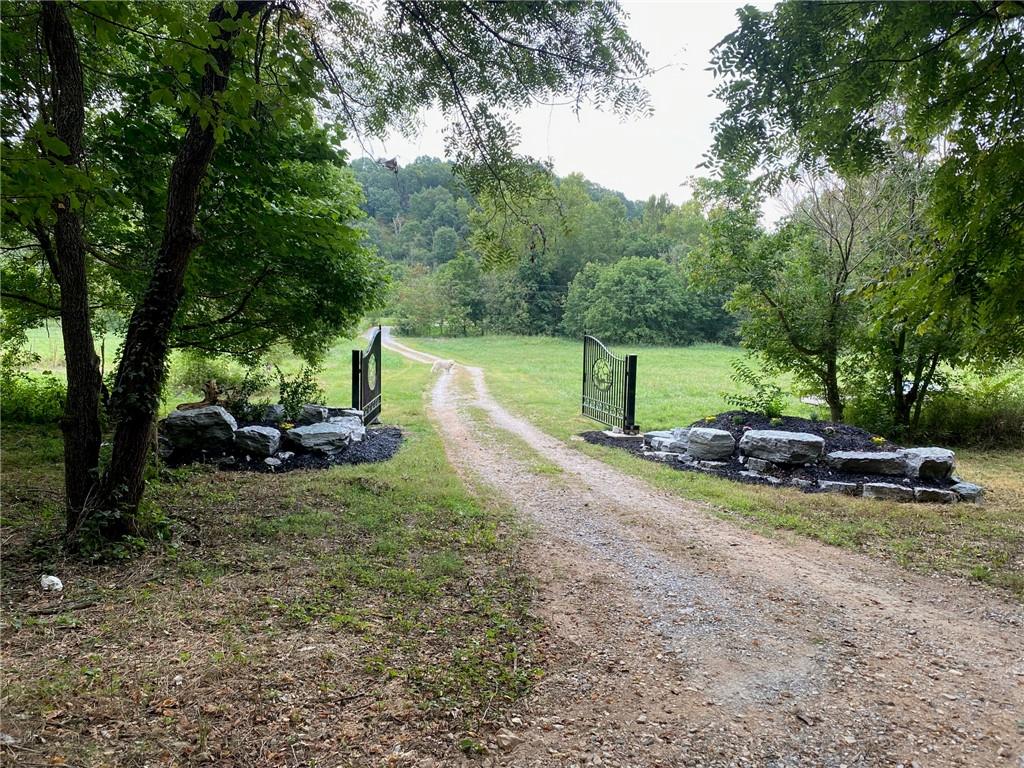 Whether you're looking to build now or invest for the future, this property offers endless possibilities. With 3.65 pristine acres to adventure, build, or simply enjoy, this is the perfect place to call home. This planned community features a beautiful scenic drive up to a 160 sq. ft. tiny home that just needs a few finishing touches, on-site is a 4-bedroom septic system, shared-well and electric available for your dream build! Enjoy incredible wildlife at every turn, stunning, star-filled night skies, and access to a beautiful shared common area right on the creek. Come experience the peace and potential of this gorgeous land!