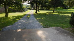 Nice little cottage in great neighborhood of larger well-kept homes-one car garage and large lot near everything but secluded.  Living room is large with smaller kitchen, bedroom and second room used as utility, storage, closet, etc.  Newer central heat and a/c-great for rental, starter or older person as has step in shower.  Cute as can be with new stove and easy access.