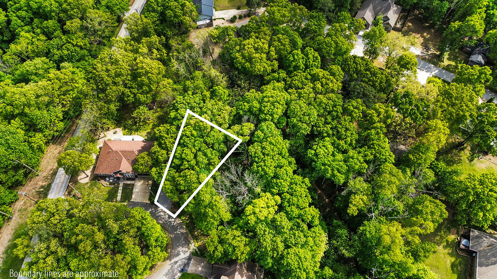 This is vacant land. Rare opportunity to own a build-ready lot in the highly desirable area of Bella Vista just steps from the new OZ Trails Bike Park. OZ TRAILS BIKE PARK features 20+ miles of gravity trails & the first chairlift-served mountain bike park in Arkansas. This wooded parcel offers a rare combination of recreation access and an easy building opportunity with a relatively flat homesite, making construction more straightforward and cost effective than many Bella Vista lots. A recent 3-bedroom perc test has already been completed, adding significant value and helping fast-track future building plans. Enjoy quick access to trails, golf, lakes, and all Bella Vista amenities while still being tucked into a peaceful natural setting. Whether you are looking to build a primary residence, second home, or investment property, this lot is positioned in one of the most sought-after growth areas in Northwest Arkansas.