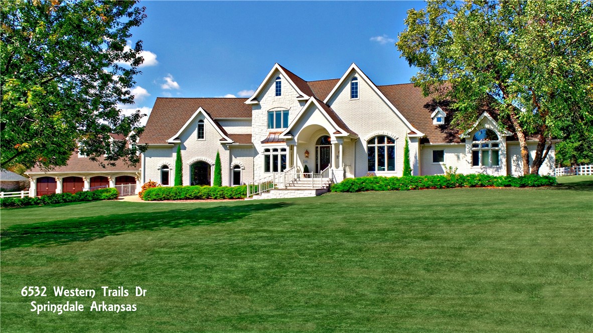 Spectacularly rare opportunity, just 5 mins from I-49, in the coveted Western Trails Equestrian Community! Enjoy 6,310 sq ft of renovated luxury on 2 level acres. 5 beds or 4 + office, 2 primary suites, 3 full & 2 half baths, huge bonus, formal dining, family, living, & flex rooms, tons of storage, 2 laundry areas, screened porch & a giant 4-car garage w/ two 12’ & two 10’ doors. Expansive composite deck w/ copper railings. A new roof will be installed July 2025—great for your insurance! 30’x40’ Morton building includes 2-car garage & shop. Entire home sealed w/ Italian Romabio masonry paint. Top-tier finishes: Sub-Zero fridge, Thermador pro range, 6’x10’ Dolemite island, hammered copper sink, Wood-Mode cabinetry, Schonbek chandeliers, Anderson windows, Hunter Douglas power shades, & enhanced Ethernet wiring. A rare blend of elegance, function & space—in a location that can’t be beat.