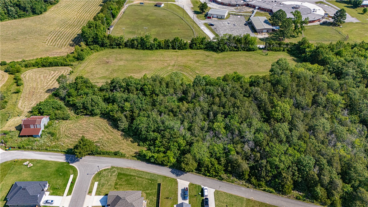 Prime 7.4± acres in the heart of West Fork! This gently rolling tract offers an excellent opportunity for development or investment, located just off Smith St with additional frontage on Park St. Conveniently situated next to West Fork Schools, minutes from downtown West Fork, and a short drive to I-49. Approximately 4 acres are cleared with the remaining 3 acres wooded, providing a desirable balance of open ground and natural surroundings. Electric and water available at the street. Layout and location offer strong potential for a future subdivision or other residential development (buyer to verify feasibility, zoning, and utilities). A rare opportunity to secure acreage in a growing area with close proximity to schools, shopping, and commuter routes!