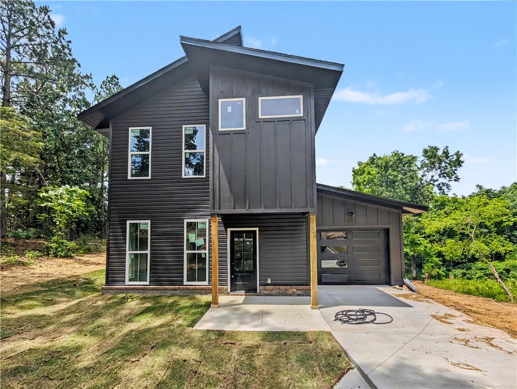 Welcome To Your Next Home At 3 Granshire Lane Where The Good Life Begins! This Sharp New Build In Bella Vista Puts You Smack In The Middle Of The Action With World-Class Mountain Bike Trails Wrapped Around You In Every Direction. Inside You Get A Bright Open Living Area With A Fireplace That Actually Makes The Room, Plus A Kitchen Built For Real Life Featuring Custom Cabinets, Bold Countertops, And An Island Big Enough To Feed The Whole Crew After A Long Day On The Trails. The Layout Just Makes Sense With A Primary Suite Upstairs Designed For Actual Rest Plus Extra Bedrooms And Baths That Keep Everyone From Getting In Each Other's Way. Top-Rated Bentonville Schools Are Part Of The Package Too. Out Back The Patio Is Ready For Morning Coffee, Cold Drinks At Sunset, Or Just Doing Absolutely Nothing And Feeling Great About It. This Is The One.