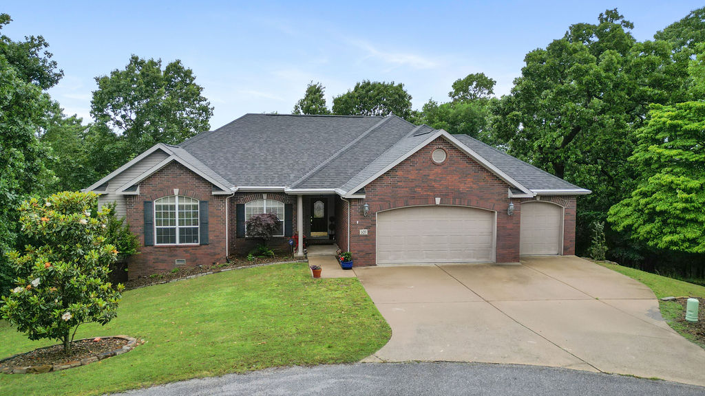 Just minutes away from Prairie Creek Marina and 5 minutes to downtown Rogers! This 4 bed, 3 1/2 bath home offer 3240 Sq ft on a private 1.24 acre cul-de-sac lot! Enjoy peaceful wooded views from the expansive deck or relax in the enclosed patio with hot tub! A New Generac generator, hardwood flooring, 2 beautifully updated bathrooms, a new fence, along with a newer roof just to name a few upgrades! Inside features a split floor plan with two living areas, plus a bonus/game room, spacious rooms, walk-in closets, abundant natural light, and ample storage make this home the perfect blend of comfort, functionality, and convenience!
