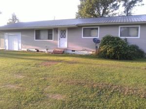 Country home on 4.8 acres, 3 bedroom 2 bath home. Fenced pasture that is fenced and cross fenced with a pond. There are some storage buildings and an older mobile home that is need of some repairs.