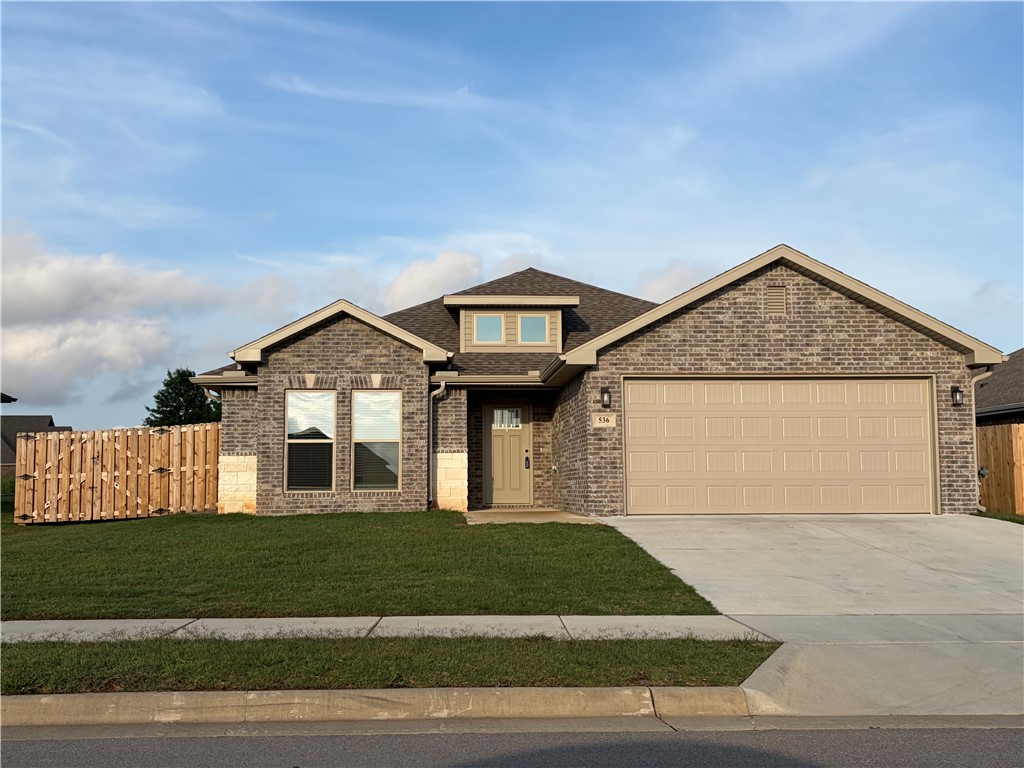 Beautiful newer 3BR/2BA home with great curb appeal and a fenced backyard! Step inside to an open, bright layout with tall ceilings, wood-look tile flooring, neutral paint, and crisp white trim. The kitchen features granite countertops, stainless appliances, gas range, pantry/laundry area, stylish pendant lighting, and a large island perfect for gathering. The dining area offers backyard views and easy access to the covered patio. Enjoy a spacious yard with privacy fencing, ideal for pets, play, or entertaining. The bathroom showcases a modern tiled walk-in shower with glass door. Move-in ready with clean finishes throughout and a warm, welcoming feel! Lawn Maintenance Included! Washer and Dryer included in rental!