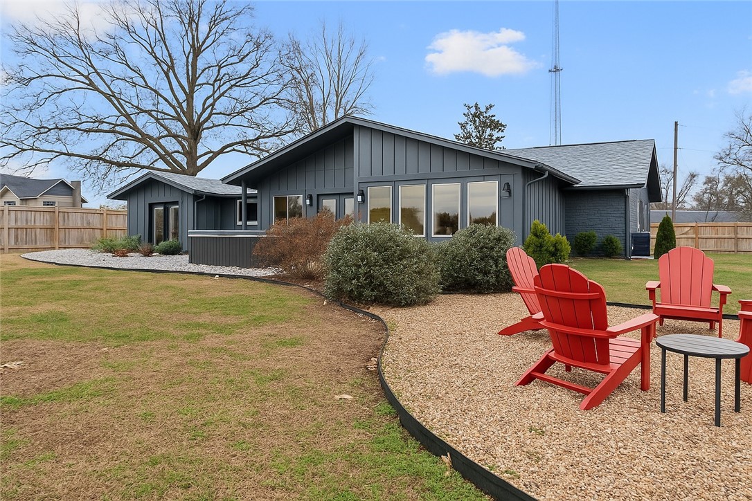 Discover a truly attractive property at 1102 NW 11th ST in Bentonville, Arkansas, a single-family residence in great condition that promises a lifestyle of comfort and ease. This ranch-style home, set on a generous 2387 square foot lot, offers a thoughtful design perfect for both relaxation and entertaining. The kitchen is a culinary delight, equipped with sleek stainless steel appliances, ready to inspire your next gourmet creation. Adjacent to this, the great room provides an expansive and welcoming space for gatherings, while the laundry room ensures everyday convenience. The home features three well-appointed bathrooms, one of which includes a luxurious double vanity and a spacious walk-in shower, offering a spa-like retreat. With two comfortable bedrooms, there is ample private space for residents. Step outside to discover your private yard, a serene escape featuring a cozy fire pit, perfect for evening gatherings under the stars.