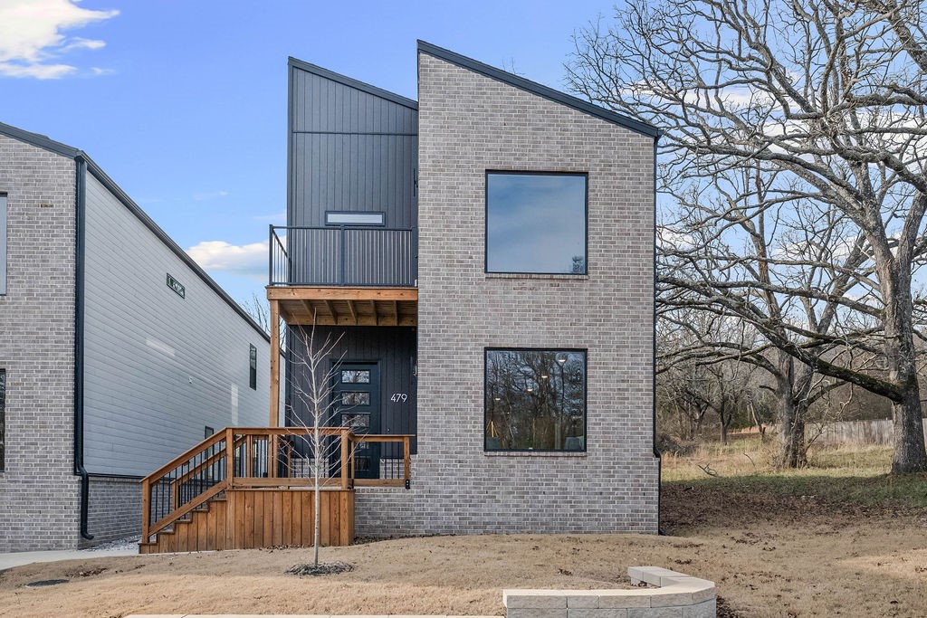 Experience the height of modern luxury in this beautifully designed urban retreat. Blending contemporary style with thoughtful functionality, this home features an open-concept filled with natural light from expansive windows, creating a bright and welcoming ambiance. The kitchen is a true centerpiece, complete with quartz countertops, custom cabinetry, and stainless steel appliances—perfect for both entertaining and everyday living. Flowing effortlessly into the spacious living areas, it sets the stage for cozy family dinners. Upstairs, the primary suite offers a peaceful escape with vaulted ceilings, a private balcony, and a sleek en-suite bathroom with a stunning tiled shower. Additional bedrooms also feature vaulted ceilings and share a second bathroom finished with modern touches. Step outside to a large rear balcony, ideal for outdoor entertaining or unwinding under the stars. Situated just 2 miles from the lively Dickson Street and Fayetteville Square, you’ll enjoy quick access to top dining and shopping.