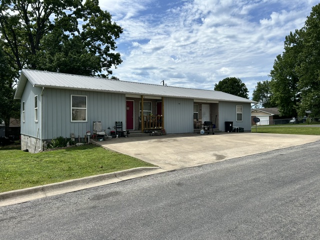 Well-built, maintenance-free duplex located on a quiet, desirable street in Berryville. This property features durable metal siding and a metal roof for long-term peace of mind. Both units include essential kitchen appliances. The duplex is currently fully occupied with reliable, long-term tenants, and Unit B has been recently remodeled. Excellent investment opportunity with stable rental history.