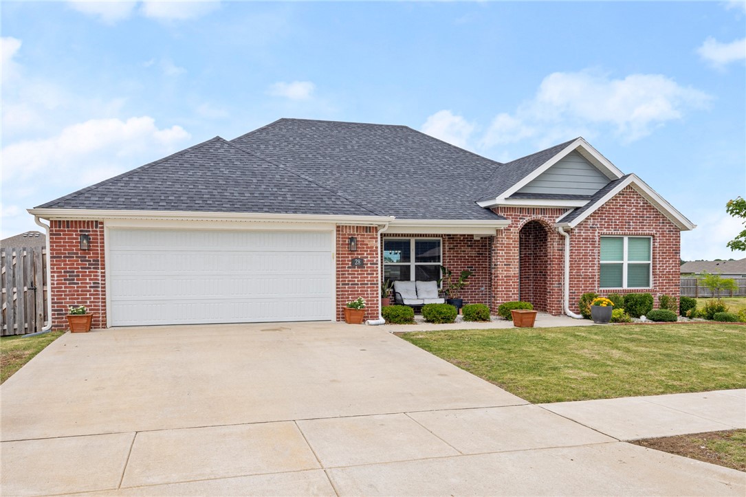 Beautiful 4-bedroom, 2-bath home built in 2022 located in the desirable Cedar Crest Subdivision in Farmington. Offering 1,843 heated sq ft on a concrete slab foundation, this well-maintained home features a functional split floor plan and a spacious 2-car attached garage. The open living area includes a cozy fireplace, creating a warm and inviting space for relaxing or entertaining. The kitchen is equipped with granite countertops, pantry, electric range, and ample cabinetry, making it both stylish and practical. Walk-in closets provide generous storage throughout the home. Situated on a 0.19-acre lot with public water and sewer, this property also includes solar panels for added energy efficiency. Enjoy the convenience of nearby trails and an easy commute with quick access to I-49, Wedington, and Hwy 62.