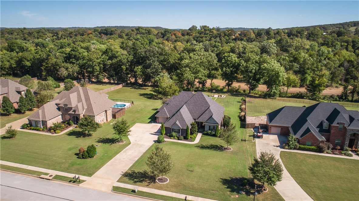 This East-Fayetteville custom-built home has it all! This estate home boasts traditional charm and elegance with elevated touches like plantation shutters and custom touches and superb functionality. With 3 bedrooms on the primary level and a fully equipped media room and office space upstairs, it will not be hard to make the most of every square foot. And for those tender toes, don't miss the heated floors in the primary bath.  But that is just the interior. Once outside, you will find an entertainer's dream delight! With views of (and access to) the White River, you can enjoy your evenings grilling and watching the game or soaking in your XL exercise spa. Waterford Estates is a community-focused neighborhood that also provides features like a clubhouse and pool. Come see what all this property has to offer - this is a Lifestyle! The upstairs office could very easily be used as a 4th bedroom.