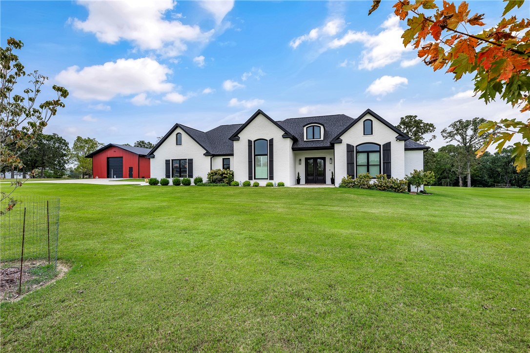 Let your imagination soar by owning this beautiful estate setting on protected 5.4 private acres.  Unmistakable thought was put into every quality detail of each room designed for living and entertaining in this open floor plan showcasing hand-scraped oak flooring throughout.  In the gourmet kitchen explore your culinary creations on the Thermador dual oven/gas range 6-burner with griddle.  Luxurious primary suite features extra -large closet, heated bathroom floor, walk-in shower and soaking tub.  Additional bedrooms have access to their own bathrooms.  Bonus room/office/media room, you decide.  Walk-in pantry, laundry, separate storage room for extra appliances; oversized 3 car garage, above ground storm shelter in garage, full staircase accessibility to attic storage; a 40’x60’x16 heated metal building for your shop/hobbies.  Too many amenities to list.  Please see the attached amenities sheet for the home and metal building.