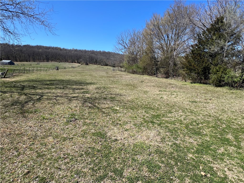 19.55+/- mostly wooded acres in E Springdale consisting of 2 parcels. The acreage offers several building sites while offering tons of privacy. This tract backs up to Woodcliff Subdivision and is super convenient to HWY 265. It's also close to Schools, parks, shopping, grocery, and mountain bikes trails.
