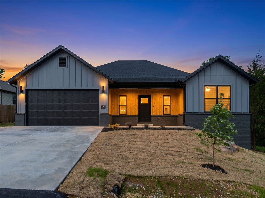 *Agent Owned*  Welcome to your NEW HOME on a larger .43 acre wooded lot. Northeast Bella Vista location in Bentonville Schools and backing up to "Flo Ride" - Part of The Back 40 Trail System - Nearly 40 miles of trails designed and built for mountain biking but also open to use by pedestrians! Extended covered deck overlooking mature trees and beautiful views. Interior features vaulted living room ceilings, modern electric fireplace, and a light colored luxury vinyl plank flooring throughout. Large kitchen island with extra storage, white quartz counters, and stainless steel appliances. Master bath has fully tiled shower and dual vanities. Dedicated laundry room with built-ins. Hot water recirculation system. One year builders warranty. See photos and MLS attachments for plans and survey. Construction will be completed and ready for move-in by early to mid June!