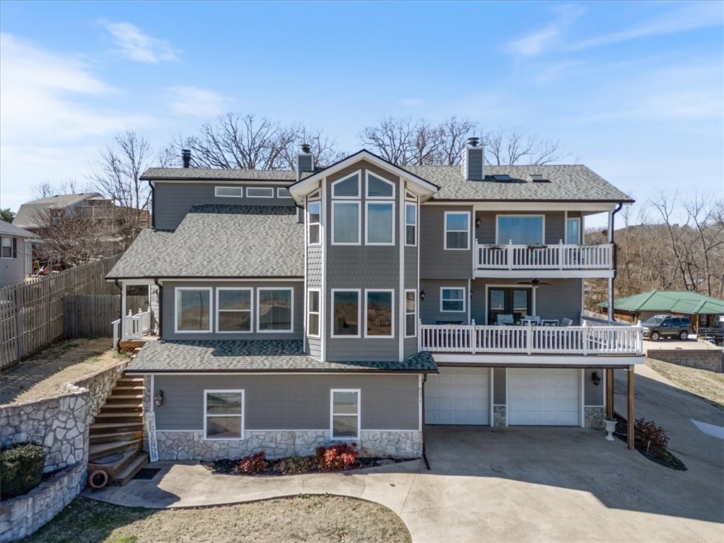 Wake up to breathtaking lakefront views on Beaver Lake;every sunrise feels like a retreat & evenings glow over the water.5BR,4BA home offers apprx.4,586SF on 3 levels blending warmth,luxury & energy efficiency.Wood&tile flrs,granite counters,spacious great rm & wet bar set the stage for gatherings.Chef’s kitchen features Viking 60” gas griddle cooktop,warming drawer & instant hot water at island.Main-level BR w/in-floor closet safe & adjacent bath w/heated floors offers comfort & ease of mind.Expansive windows capture panoramic lake views filling the home w/natural light.Great rm wood FP;primary BR FP w/gas insert.Resort-style outdoor living w/private 28,000-gal saltwater pool(9ft deep)&pool house w/Pella windows,waterfall & hot tub.New roof,gutters,soffit/fascia Aug 2024.75 owned solar panels avg apprx.$25/mo electric 10 mos/yr.Heat pump,tankless WH,oversized insulated garage,RV parking w/30-amp plug&50-amp garage plug,ADT sec. w/4 ext cameras.Substantially below recent appraisal.Preferred lender credit available.