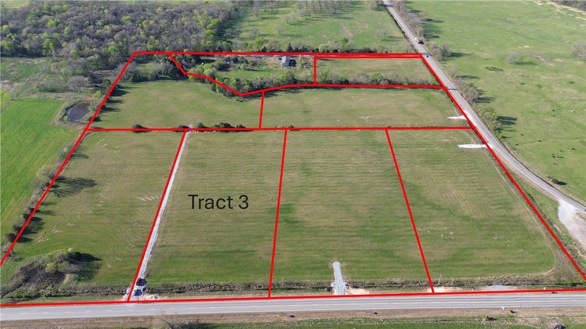 Tract 3 is 4.85 acres and is located off of hwy 102 in western Benton County.  Located off of paved road with electric and rural water at the street, this tract provides an excellent oppotunity to live in the country but have convenient access to Gravette, Decatur, Siloam Springs and the rest of NWA.