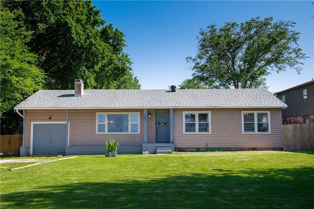 This is it! This is the one! Only a half mile from I-49, a 4 minute drive from the U of A, across the street from the Fayetteville trail system,  a U of A bus stop just two doors down. Not only is this home in the perfect location, but it is also full of stylish/functional updates. Boasting an updated kitchen, two updated bathrooms, updated light fixtures throughout and luxury vinyl plank flooring in the living room- this home has that wow factor you're looking for! The house is extremely spacious with two living areas and an oversized kitchen as well as generously sized bedrooms. The fenced in backyard is just a cherry on top. Come see this unique rental today before it's gone! Property is agent owned.