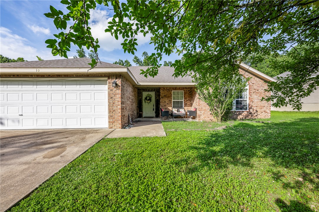 Charming 3-bed, 2-bath home nestled on a quiet cul-de-sac in a private subdivision, offering both privacy & convenience. The desirable split-floor plan provides comfortable everyday living, while the welcoming front porch is the perfect place to relax with a favorite beverage or enjoy conversation with friends & neighbors. Enjoy outdoor living in a sizable fenced backyard featuring a spacious deck, ideal for entertaining or unwinding at the end of the day. Outdoor enthusiasts will appreciate being just 3 minutes from Tiree Park & Loch Lomond Lake.  Adventure is also close by, with the Little Sugar Trail only 3.7 miles away, connecting to the popular Tunnel Vision Mountain Bike Trail. Conveniently located just minutes from Highland Blvd & the Bella Vista Bypass, this home offers quick access to shopping, dining, & all that NW Arkansas has to offer while maintaining a peaceful neighborhood setting.