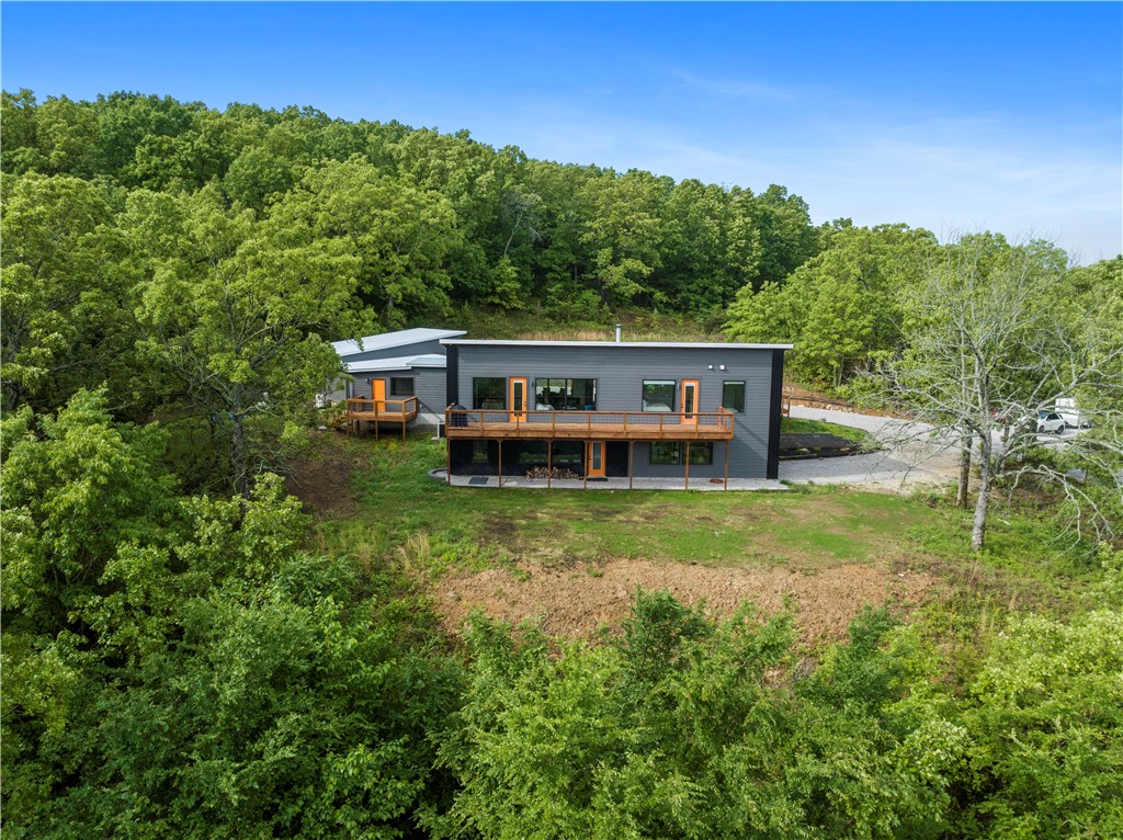 Modern Luxury Retreat - with Million Dollar Views. Indulge in  unparalleled sophistication with this custom-built luxury home, a true gem nestled on a gated 4.69-acre expanse of serene hillside. Every detail of this residence exudes elegance and opulence, offering a picturesque retreat with breathtaking valley views from the living spaces and expansive decks.New additions include a front deck office with a private entrance, a mudroom bathroom, and an impressive temperature-controlled garage featuring multiple stories, a loft, and a walk-in shower with dog attachments. Whether you seek to entertain lavishly or find peace in nature, this home offers an array of luxurious amenities to suit every lifestyle. 

Discover a wood-burning stove, a water filtration system, and numerous enhancements throughout. The large window gym provides a flexible living space.  Love the black Anderson windows!