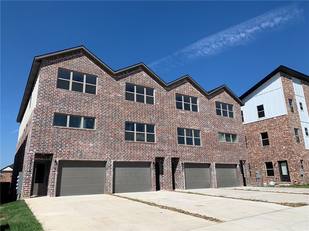 AMAZING location—right across from Osage Park, Lake Bentonville, and Bentonville Airport (private planes only, so minimal noise). Enjoy quick access to Climb Bentonville, Bentonville Brewing, just 10 minutes to Walmart HQ, and under 15 minutes to Bentonville Square. The second level boasts an open-concept living area with great natural light and modern fixtures. Kitchen features white cabinets and sleek white quartz countertops. Primary suite offers a marbled walk-in shower and double vanity. Third floor includes 2 guest rooms, full bath, office nook, and a HUGE storage room. Main level has a tandem 2-car garage, more storage, and access to a fenced backyard with patio. Stackable W/D required. Non-functioning fireplace. **$250 non-refundable pet deposit + $35/month pet rent per pet**