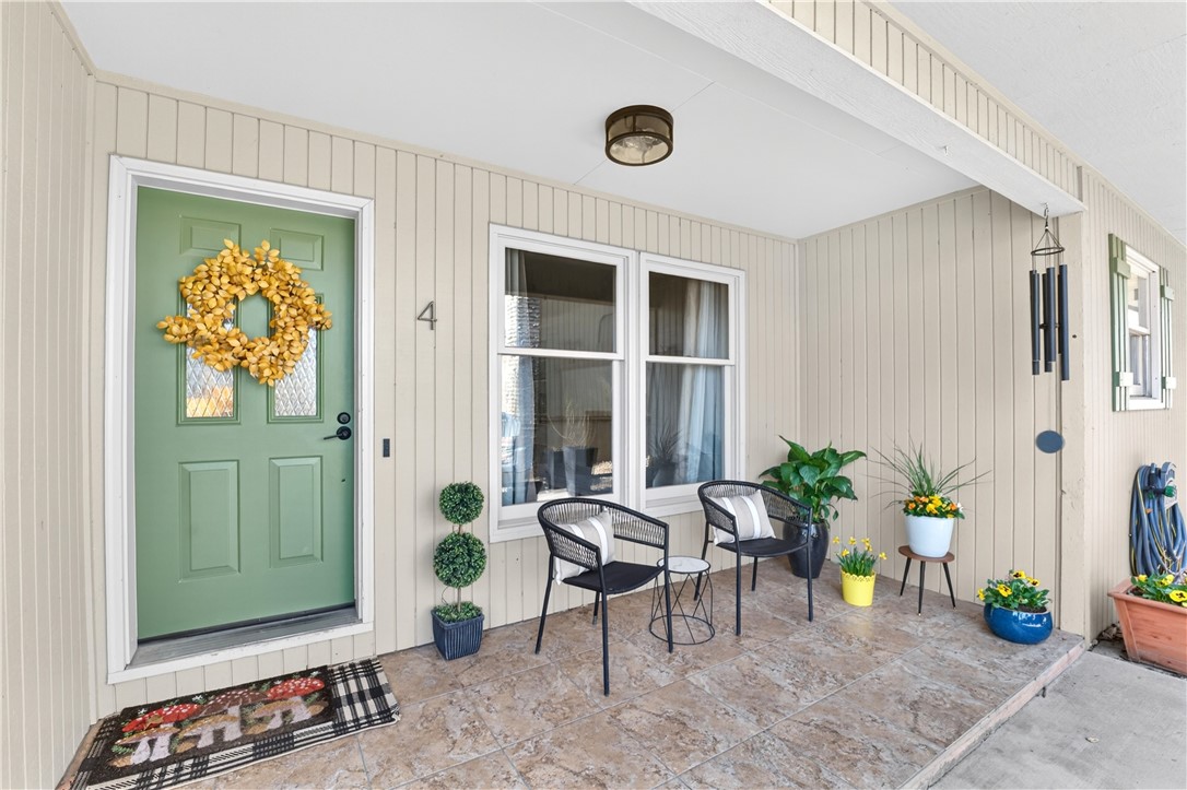 Welcome to this charming 2-bedroom, 2.5-bath low maintenance townhome perfectly located only 4 minutes from the new Oz Bike Park and 2 Minutes from Kingsdale recreation center and golf course. Step outside and enjoy a paved walking path around the neighborhood with a beautiful lake view. The spacious deck offers beautiful views and a peaceful place to relax or entertain. Enjoy a GARAGE for your bikes or car! Adventure starts right at your front door. Bike to Little Sugar trails, ride over to the Oz bike park, or continue on the trail system all the way to Bentonville. Inside, you’ll find an open floorplan, a basement that is great for flex space like an office, additional living area, or home gym, warm walnut wood floors, & a cozy wood-burning fireplace. The POA covers exterior maintenance, termite protection, and routine pest spraying, making ownership simple and convenient. You'll also gain access to community amenities like: golf courses, country clubs, tennis, pickleball, archery, gyms, saunas, pools, and more!