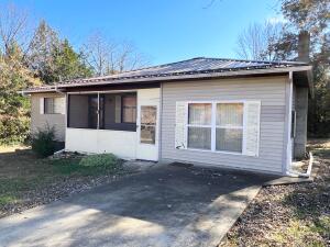 Lake Community Special!! This 2 BR 1 BA home sits on 2 great sized lots just 4 minutes from a public boat launch and marina on beautiful Bull Shoals Lake. With just a few updates you can add your style to your new lake house. This property has a living room, plus an added den that could be used for a bunk room or more living space. There is also a 24 x 34 (approx) detached  garage/shop that you can store your lake toys in. Won't last long at this price, Schedule your showing today.  Property selling ''AS-IS''
