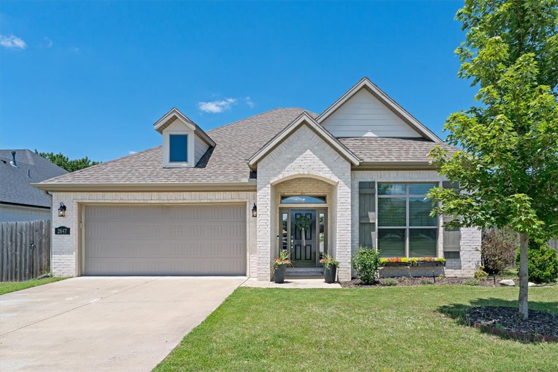 Welcome home to this stunning, well-kept 3-bedroom, 2-bathroom home in the highly desirable Riverwalk Subdivision of Southeast Fayetteville! Blending Craftsman charm with exceptional outdoor living, this home features an open, split floor plan with warm hardwood floors throughout the main living areas. The chef’s kitchen boasts custom cabinetry, an oversized island, quartz countertops, and stainless steel appliances. The living room is anchored by a cozy gas fireplace with a stone surround and custom wood mantel. The private primary suite offers vaulted ceilings, a jetted tub, separate walk-in shower, and spacious walk-in closet. Enjoy abundant storage and a 2-car garage. Outside, relax on the extended partially covered patio overlooking a level, private backyard with no rear neighbors, backing to an open field and lined with privacy trees. Riverwalk amenities include a neighborhood pool, sidewalks and direct trail access to the White River, with Stonebridge Golf Course just minutes away.