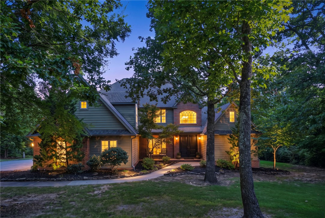 Discover exceptional luxury living in the prestigious Overton Park Subdivision of East Fayetteville. Situated on nearly 2 private, tree-filled acres at the end of a quiet cul-de-sac, this custom-built home showcases outstanding craftsmanship and thoughtful attention to detail throughout. Each bedroom features its own private en-suite bathroom. The spacious gourmet kitchen is equipped with double ovens, abundant cabinetry, and generous workspace. The living room has soaring cathedral ceilings and a stunning oversized ornate fireplace that serves as the home's centerpiece. The oversized primary suite offers a true retreat, complete with its own cozy fireplace and luxurious feel. Step outside to enjoy the expansive back deck overlooking the beautifully wooded backyard, where mature trees provide privacy and a unique zipline adds an extra touch of fun and adventure. With 3,972 square feet of beautifully designed living space and timeless custom finishes, this exceptional home offers a one of a kind must-see property.