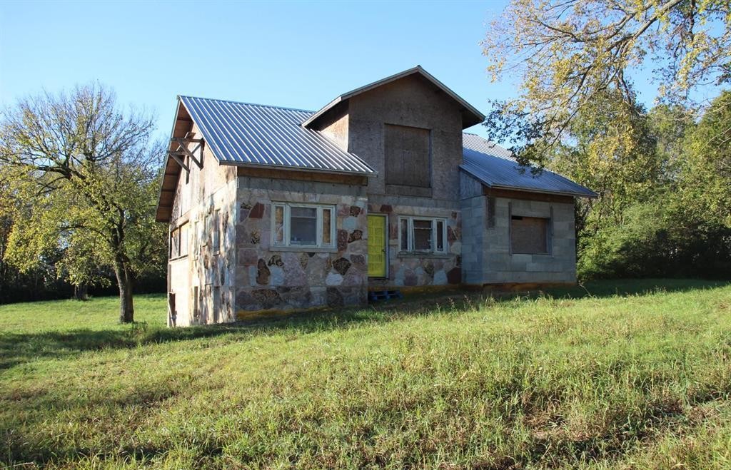Fixer upper in town with tons of potential. This stone home could be designed to any floorplan you choose. Currently there is some interior
framing to make a 3- or 4-bedroom home, but you can make it what you want. There is a main level a partial basement with garage area and an
upper level. Main level has 1886 sq ft and another 1886 on upper level and approx. 900 sq ft in the basement that could be finished out. This
home could be a real showstopper and sits on two level lots totaling .89 of an acre m/l. Sq. ft. is not heated or cooled.