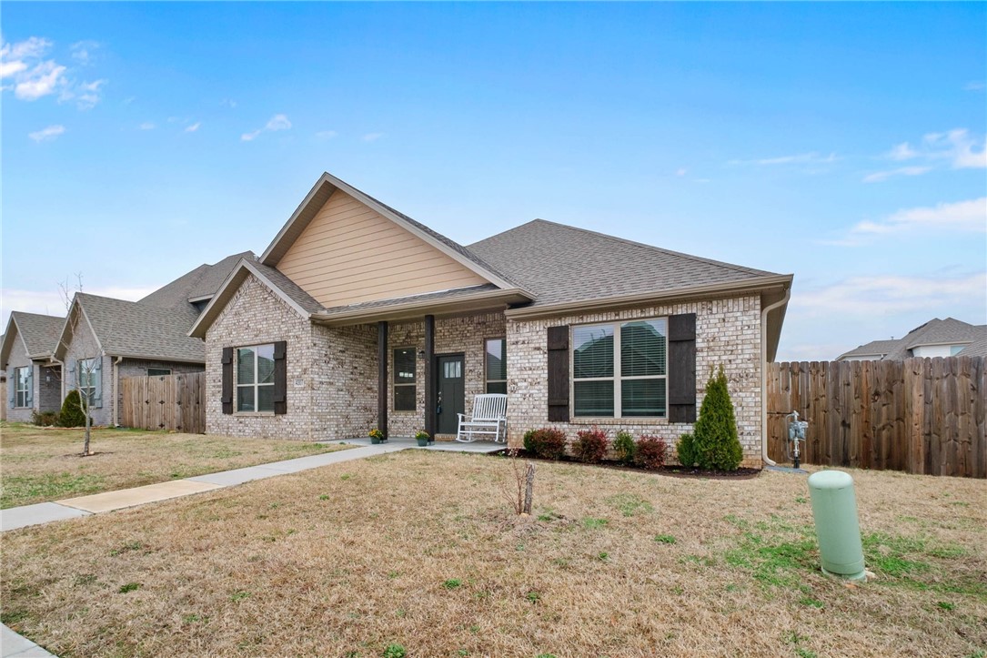 Move-in-Ready!! Alley-access 2 car garage. Welcome home to West Bentonville! Offering a balance of suburban amenities while maintaining rural character! Built in 2023 this home has been maintained exceptionally well from the base moulding up to the crown moulding! Step into this expansive open living room and kitchen boasting tons of natural light, perfect for entertaining friends and family or convenience for everyday life. Beautiful granite countertops, stylish white cabinetry, walk-in pantry, and dedicated laundry room with plenty of storage and counter space. Wait till you see this large primary bedroom with trey ceiling and the primary bathroom with double sinks, a gorgeous, tiled walk-in shower, and a large walk-in closet with ample space! The secondary bedrooms are also large with plenty of closet space and a secondary bathroom conveniently located between the two. Come see for yourself as you drive up to this beautiful home the curb appeal is outstanding along with all of the other exceptional qualities!