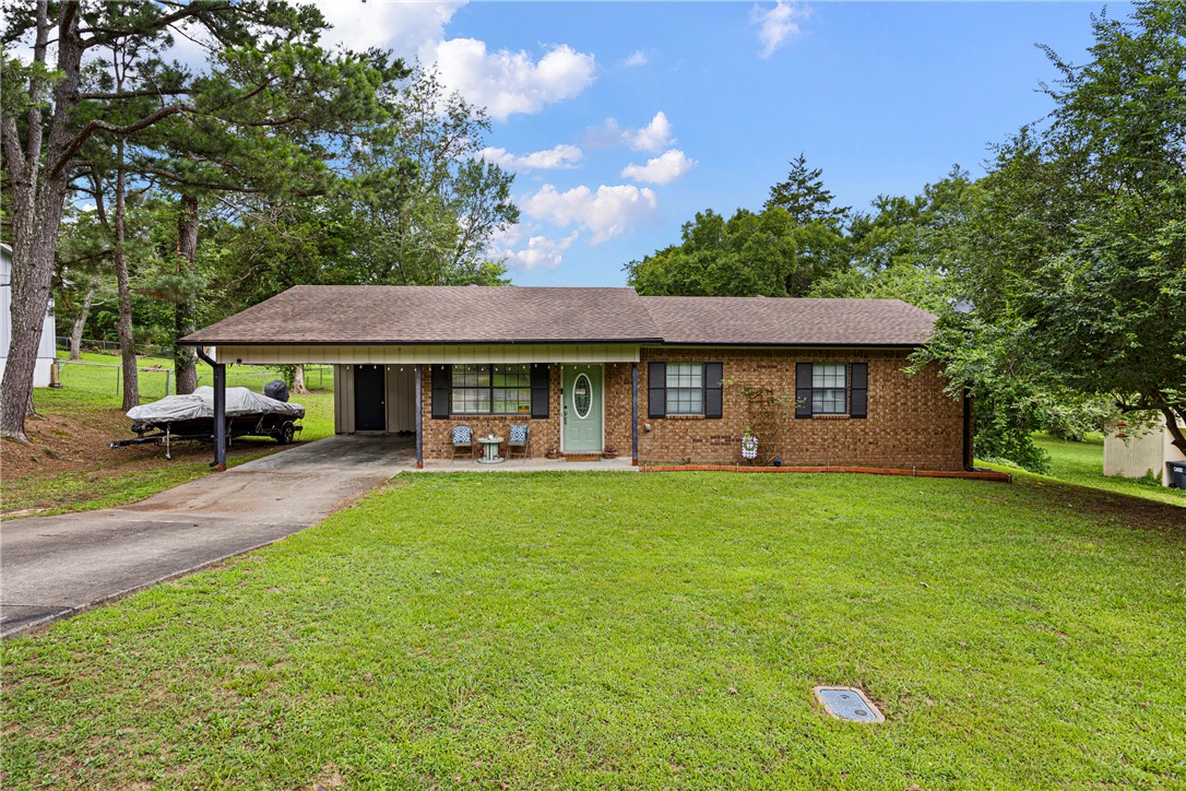 Welcome home to this charming 3-bedroom, 1.5-bath property tucked away on a quiet dead-end street in Russellville. From the moment you step inside, you’ll appreciate the many recent updates, including new flooring, fresh paint, updated bathrooms, new appliances, new doors, and modern fixtures throughout.
The spacious living room flows seamlessly into the eat-in kitchen, creating the perfect space for everyday living, entertaining friends, and gathering with family. Need extra storage? This home offers a large storage room off the attached carport plus abundant attic storage, giving you plenty of room for all your seasonal items, hobbies, and extras.
Enjoy your morning coffee on the welcoming front porch or unwind in the evenings on the back deck overlooking the backyard. Conveniently located just minutes from I-40, Arkansas Tech University, schools, shopping, dining, and everything Russellville has to offer, this home combines comfort, convenience, and value in one attractive package.