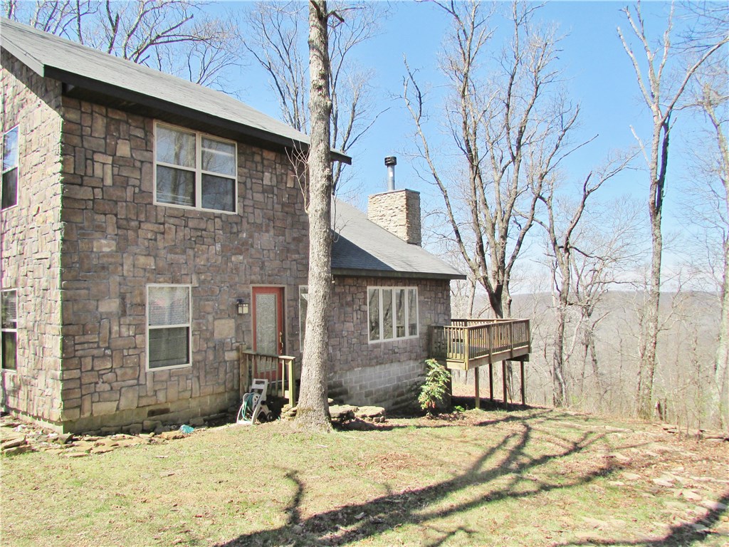 The bonus room upstairs could easily be converted to a 3rd bedroom.  Secluded.  Outstanding living area with tall ceilings and plenty of light.  The wrap-around deck is perfect for relaxing and enjoying the view.  The bath has a walk-in shower and a jet tub.