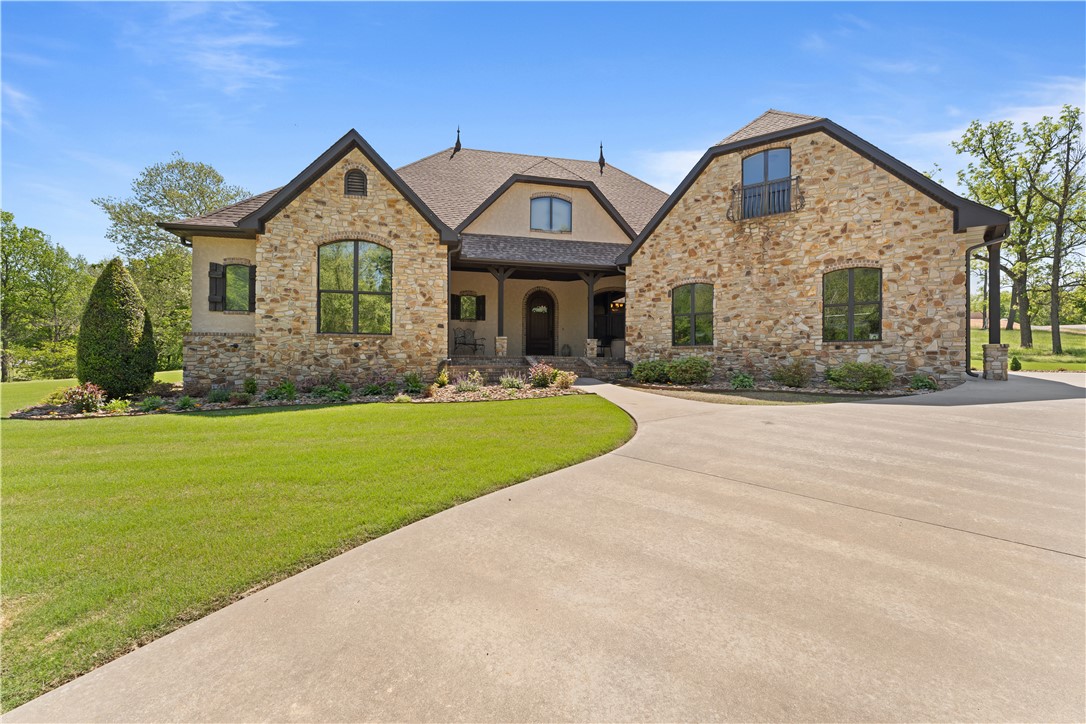 Nestled on a one-acre lot in highly sought-after East Fayetteville, this custom-built masterpiece offers guaranteed seclusion with a tranquil wet weather creek on one side and protected POA land across. Arrive via the paved circular drive to your oversized three-car garage before entering an arched foyer that opens into a stunning living space defined by 10-to-12-foot ceilings, crown molding, and a breathtaking fireplace. The chef’s kitchen is a triumph of efficiency and style, featuring luxury conveniences like a pot filler, spice cabinets, and custom corbels, while the formal dining room captivates with unique hand-sculpted walls. Every inch of this home—from the sturdy 6-inch exterior walls to the brand-new 2025 roof, gutters, and appliances—has been thoughtfully designed for longevity and elegance. Transition seamlessly to the ultimate entertainer’s backyard, where a landscaped paradise awaits with a vaulted covered patio, an outdoor kitchen, and a rocked fire pit. Most contents of home are negotiable.