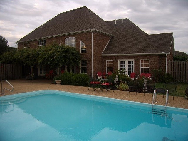 Custom built home with quality throughout. Granite counters, oak cabinets, crown molding and interior doors, spacious master bedroom with huge walk-in closet, quality kitchen with Jenn-air appliances, 17' double trey ceiling in living room, 1,920 sf detached garage with 612 sf exercise room, 19x36 in-ground pool with slide and dive board, yard sprinkler and more.