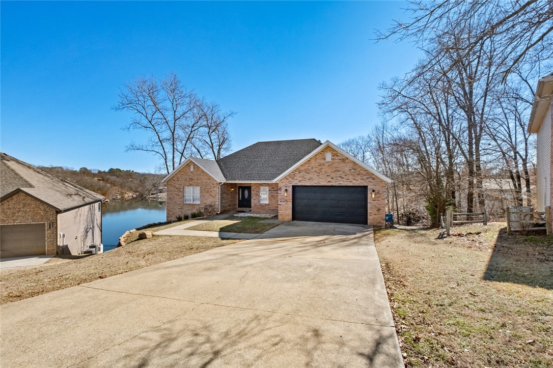Completely renovated Lakefront home. This home was professionally renovated & updated. It has a successful tenure in the Short-term rental market and has been permitted by the city. Two-story with walk-out basement. Multiple living areas, two kitchens. Lake Front is one of the fantastic Bella Vista lakes. 
The home is a short-term rental.