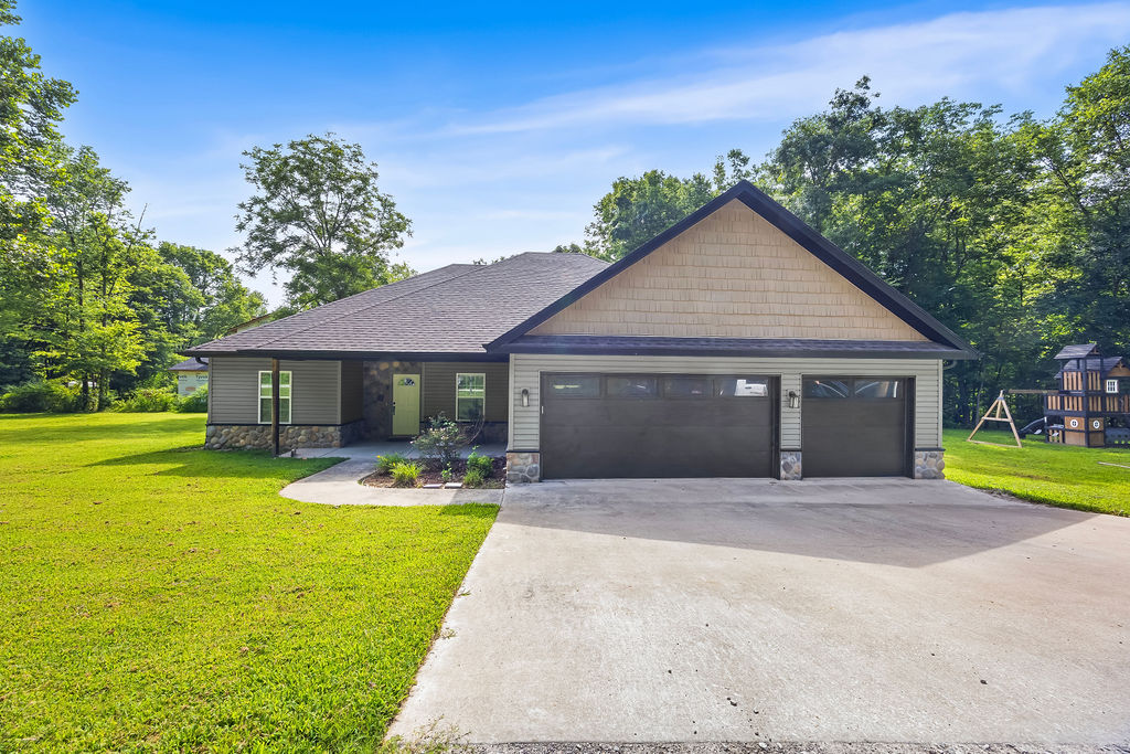 Beautiful home on a rare flat double lot in Bella Vista! This stunning 3-bedroom, 2-bath home with a dedicated office offers the perfect blend of style and functionality. The spacious kitchen is the heart of the home, featuring abundant cabinetry, extensive countertop space, and plenty of room for cooking and entertaining. The open living area showcases soaring vaulted ceilings with decorative exposed beams, creating a warm and inviting atmosphere.
The split floor plan provides privacy, while the spacious primary suite offers a large walk-in closet and a relaxing jetted tub. Enjoy the convenience of a 3-car garage, a covered back patio, and a beautifully level yard.  Don't miss your chance to own this exceptional home!