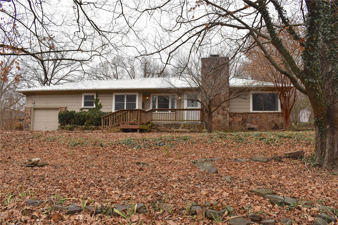 Location!!! Great investment opportunity in the heart of Fayetteville. This Wilson Park home is walking distance to the bicycle trails, Dickson St, UofA, and many more! Enjoy your mother-in-law suite or share separately to fit your needs. The fenced-in backyard is a gardeners dream with multiple garden beds, ample space,and french drains. Come see this charm for yourself.